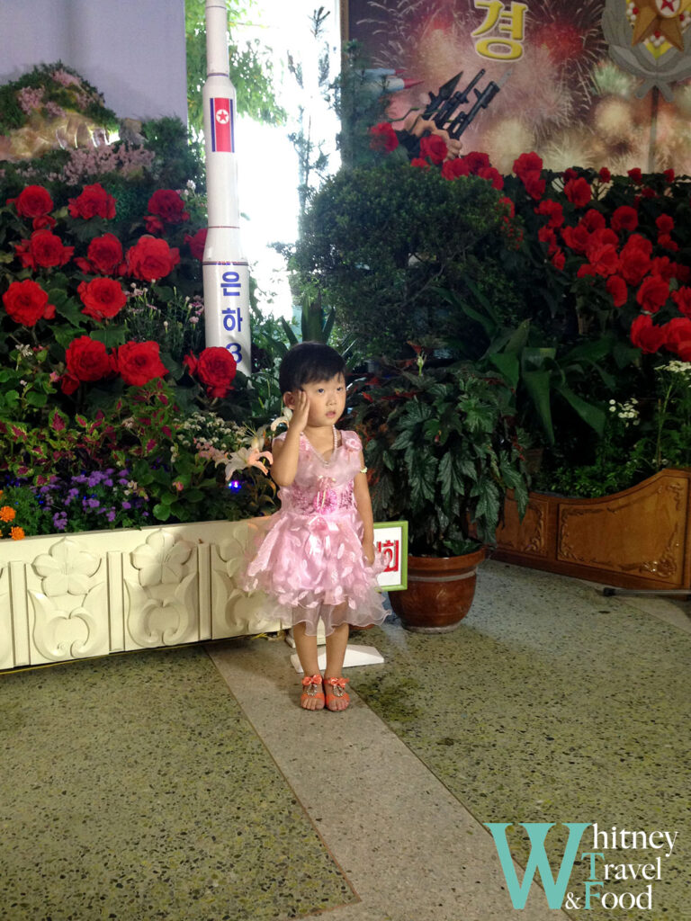 North Korea 4 Days Children saluting the nuclear weapons