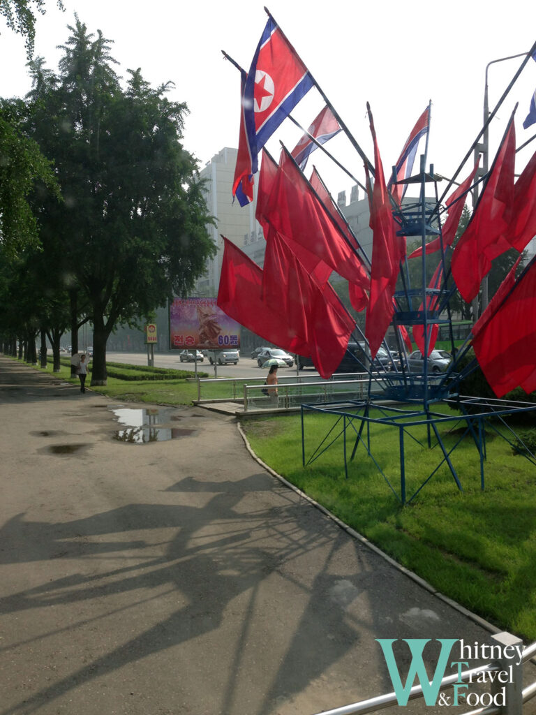 North Korea 4 Days Trip The streets are filled with North Korean flags and red flags symbolizing the Communist Party